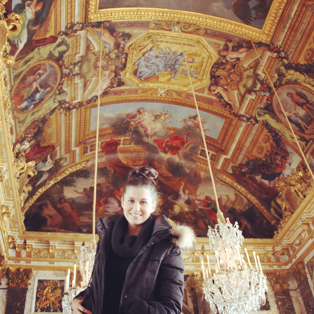 Woman posing in the Hall of Mirrors - Versailles Palace - France