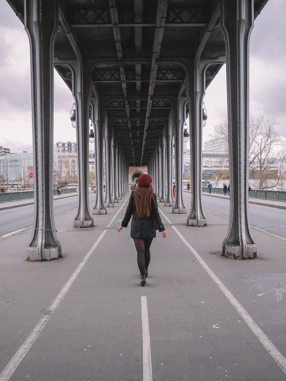 Walking down the symmetrical Bir Hakeim Bridge - Paris - France