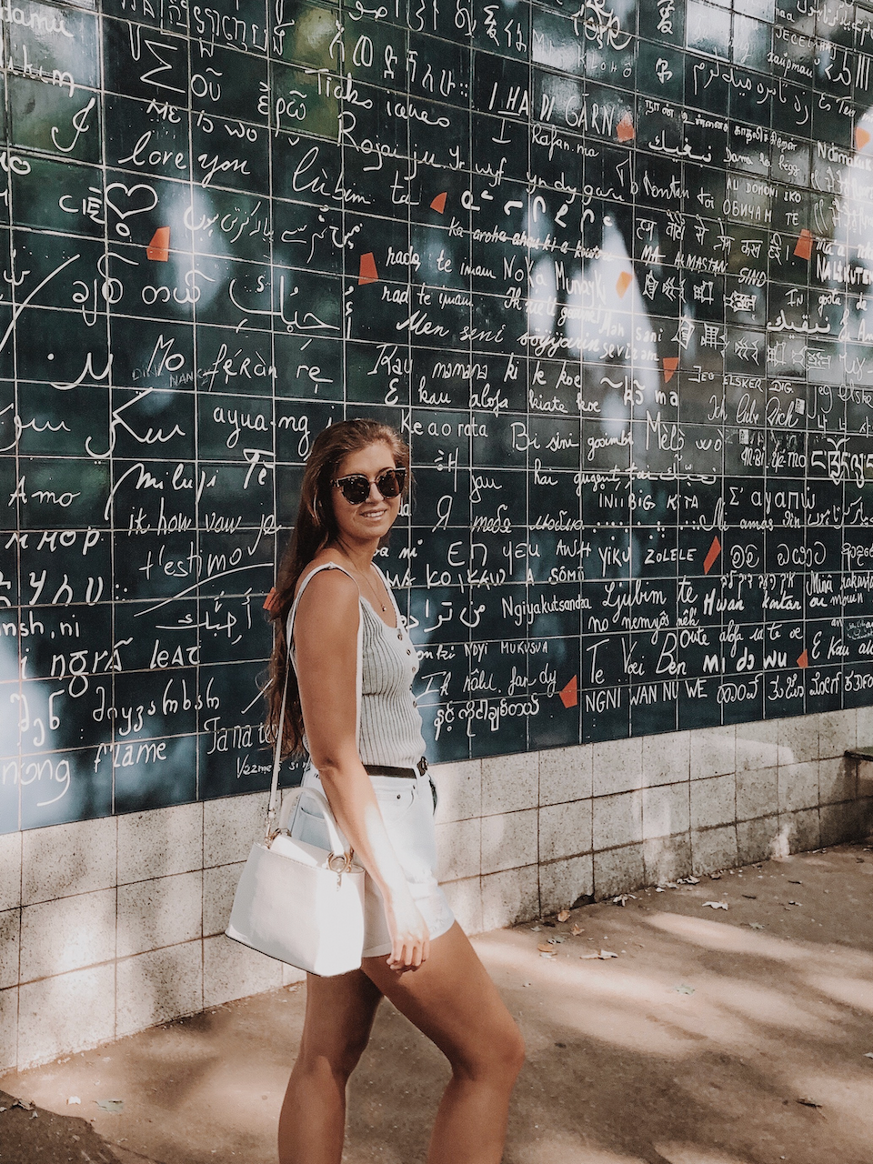 Woman in front of the Wall of Love - Paris - France