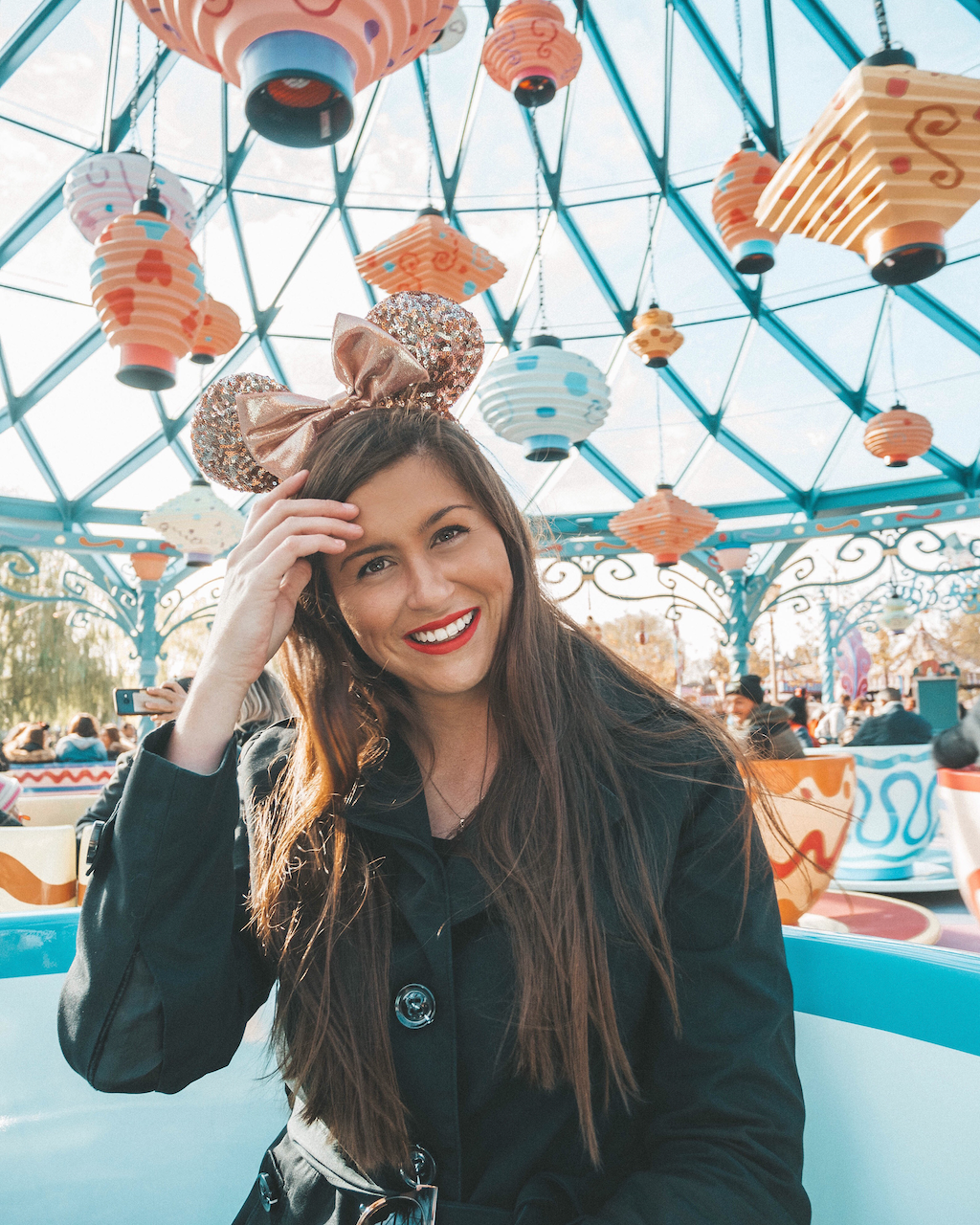 Woman having fun in Mad Hatter's tea cups - Disneyland Paris - Paris - France