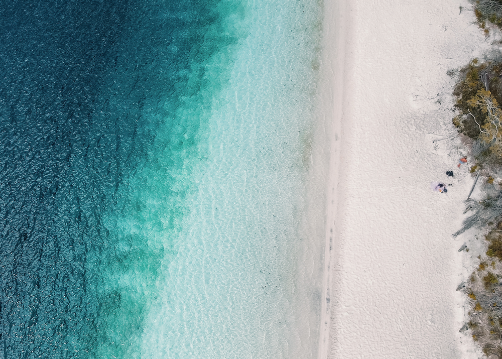 Aerial Drone Shot of Lake McKenzie with shades of blue - K'gari (Fraser Island) - Queensland - Australia