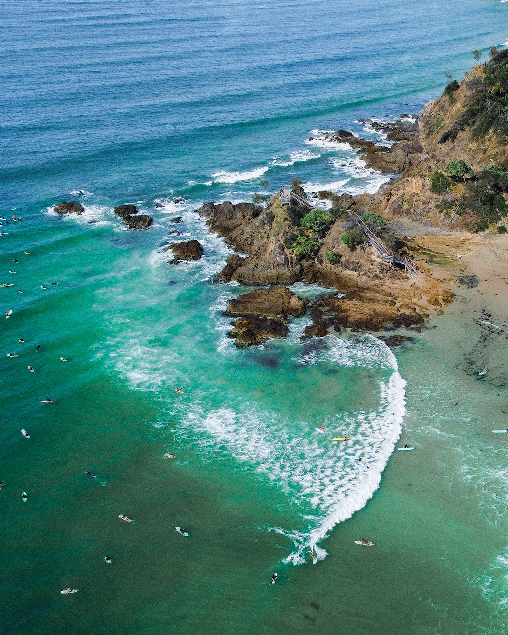 DJI Mavic Mini 2 - Aerial view of surfer and Fisherman's Lookout at the Pass - Byron Bay - New South Wales - Australia