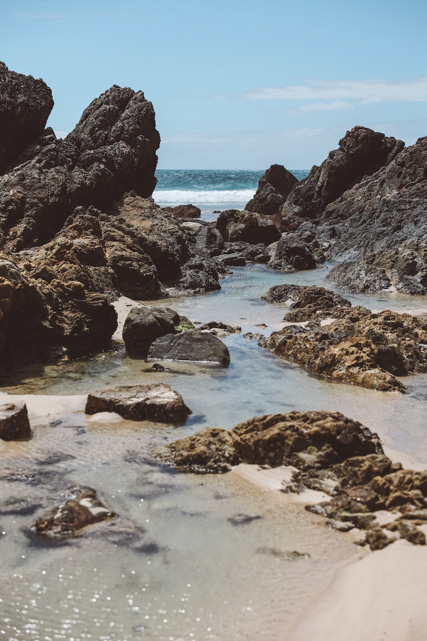 Low tide and tidal pools at Tallow Beach - Byron Bay - New South Wales - Australia
