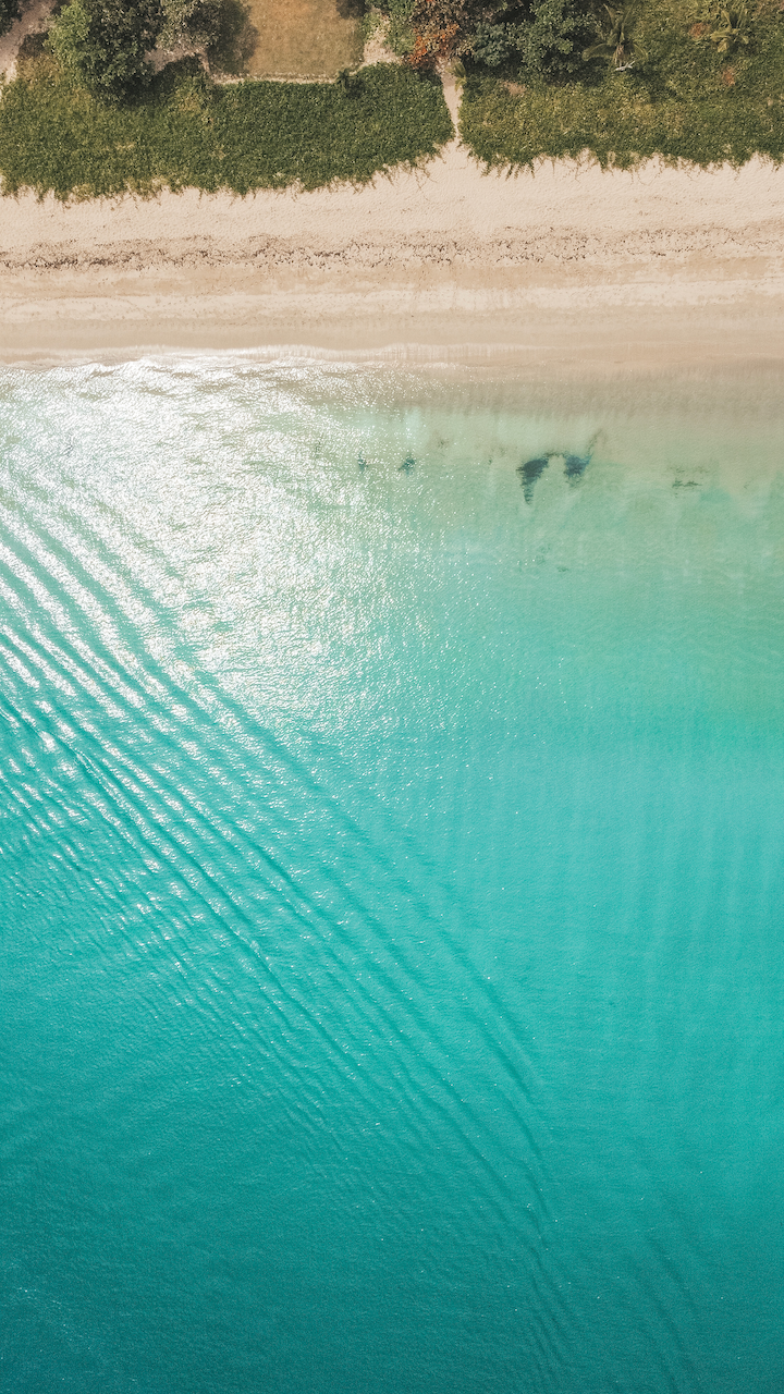 Beautiful bright blue water of Natadola Beach seen by drone - Nadi - Viti Levu Island - Fiji