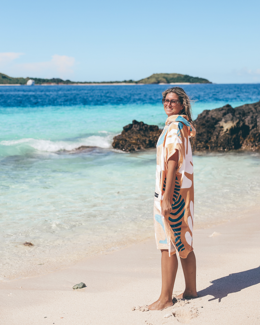 Woman in her poncho on the beach on Castaway Island - Mamanuca Islands - Fiji