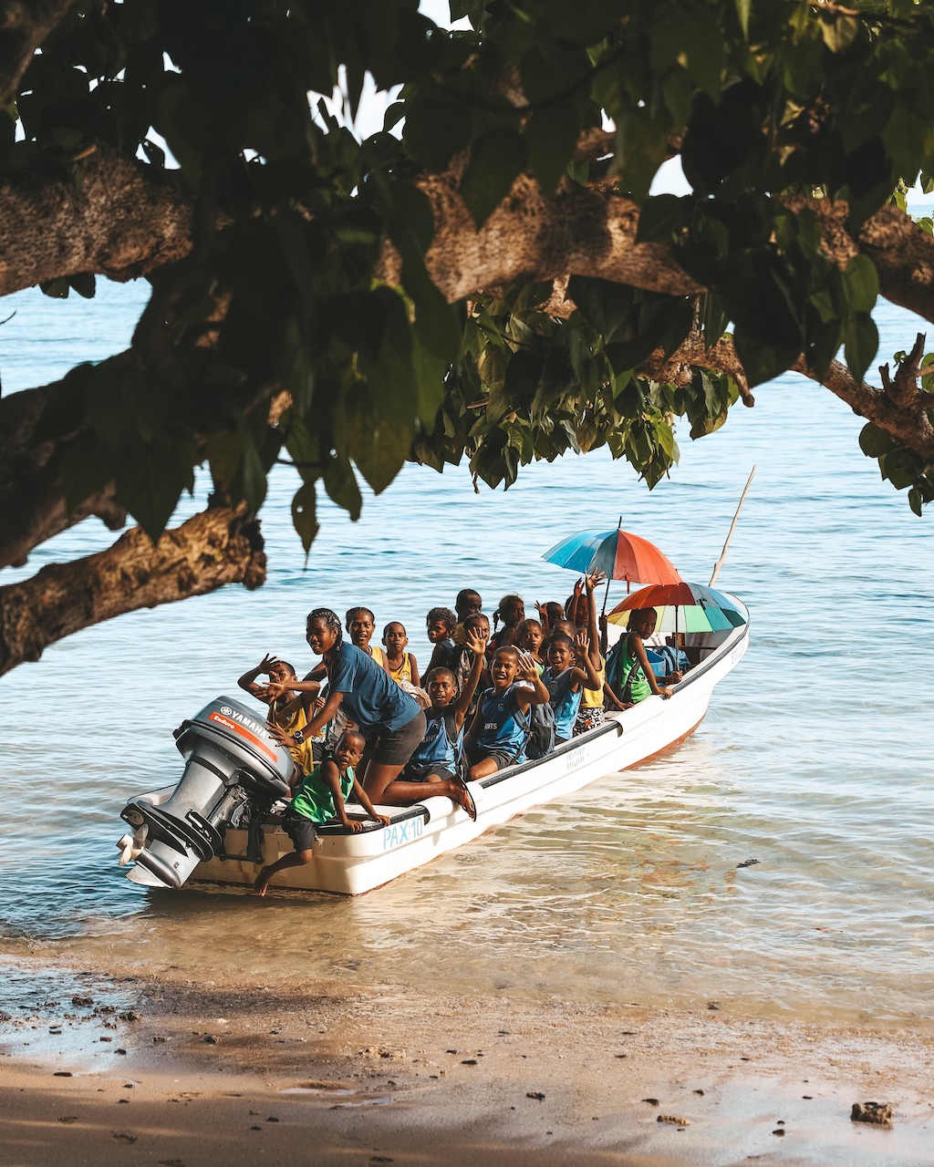 Kids going back home after school via boat - Taveuni Island - Fiji