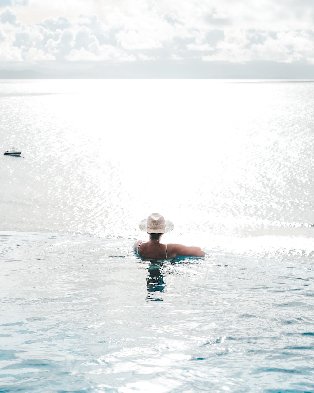 Woman contemplating the view from Raitotoka Eco Resort infinity pool in Matei - Taveuni Island - Fiji