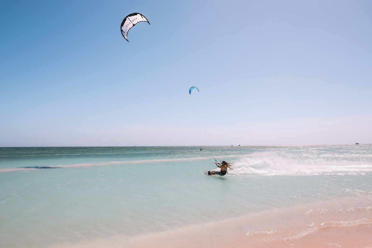 Professional kitesurfer speeding on the water near Palm Beach - Aruba - ABC Islands