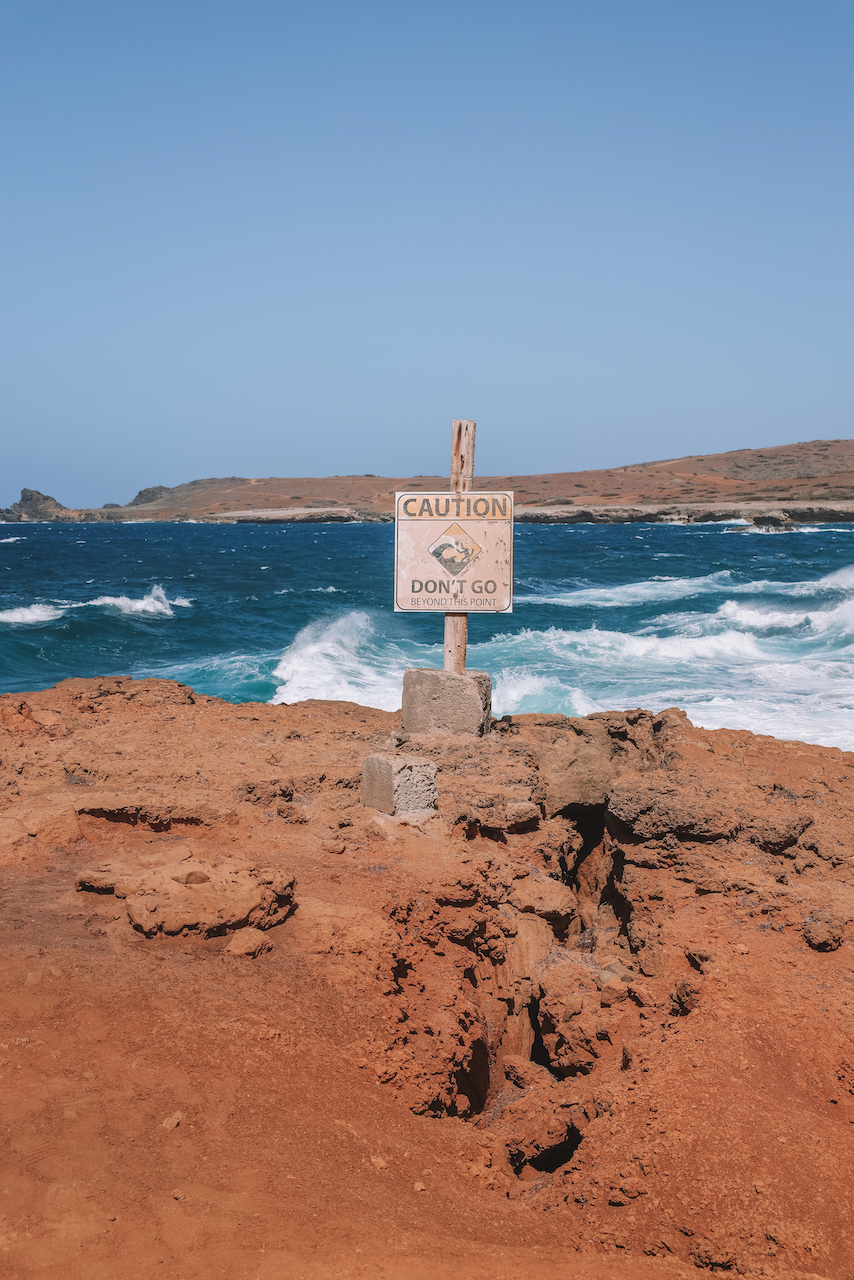Caution Sign at the Natural Bridge - Aruba - ABC Islands