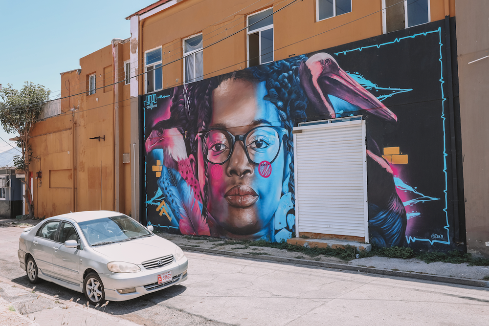Graffiti wall and a car in San Nicolas - Aruba - ABC Islands