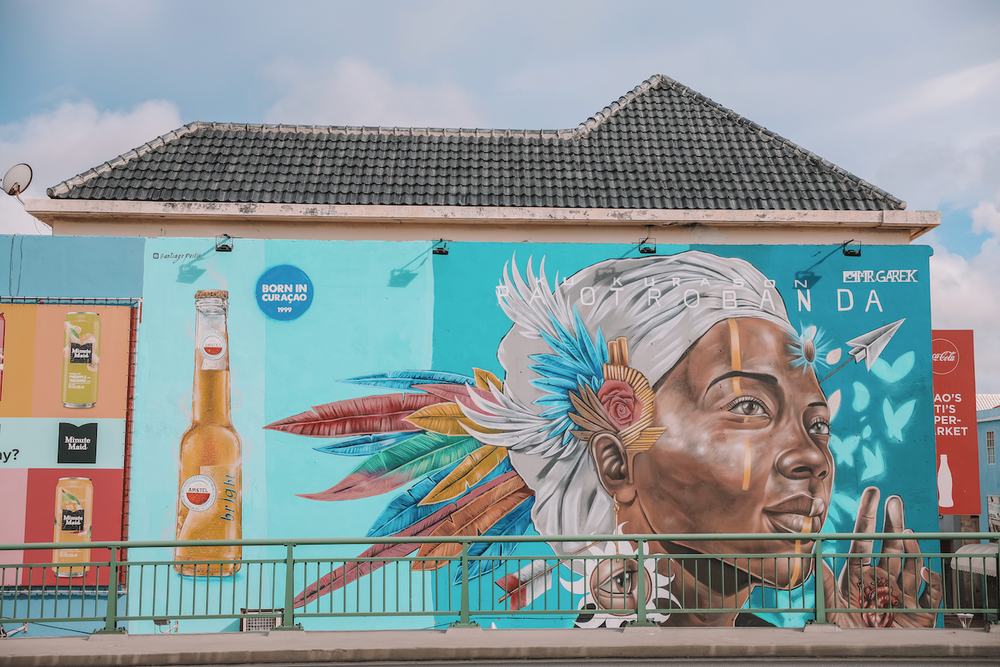 Mural of black woman with traditional head pieces with feathers - Willemstad - Curaçao - ABC Islands