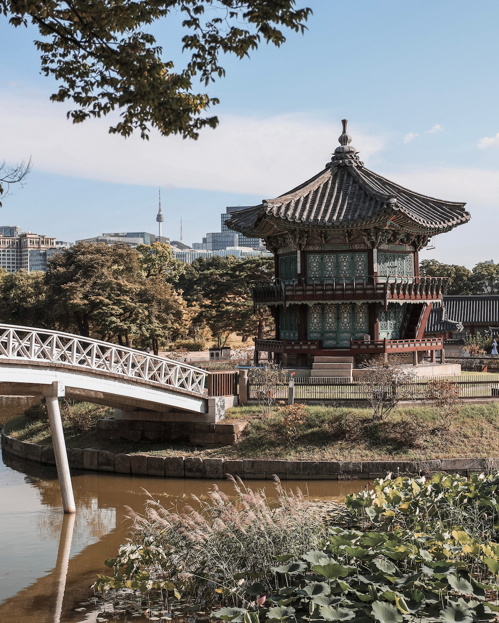 Hyangwonjeong Pavilion and the city in the background - Gyeongbokgung Palace - Seoul - South Korea