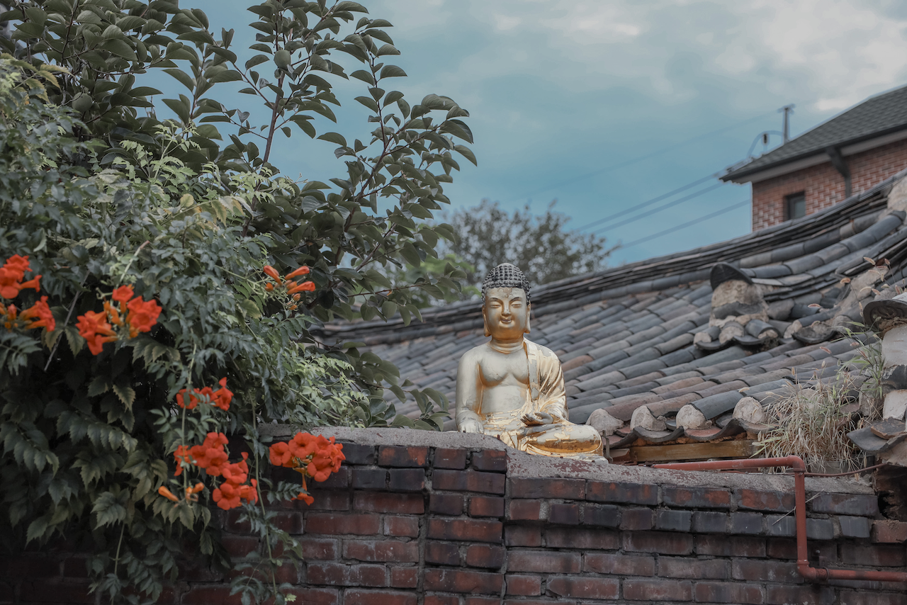 Cute little Buddha statue in Bukchon Hanok - Seoul - South Korea