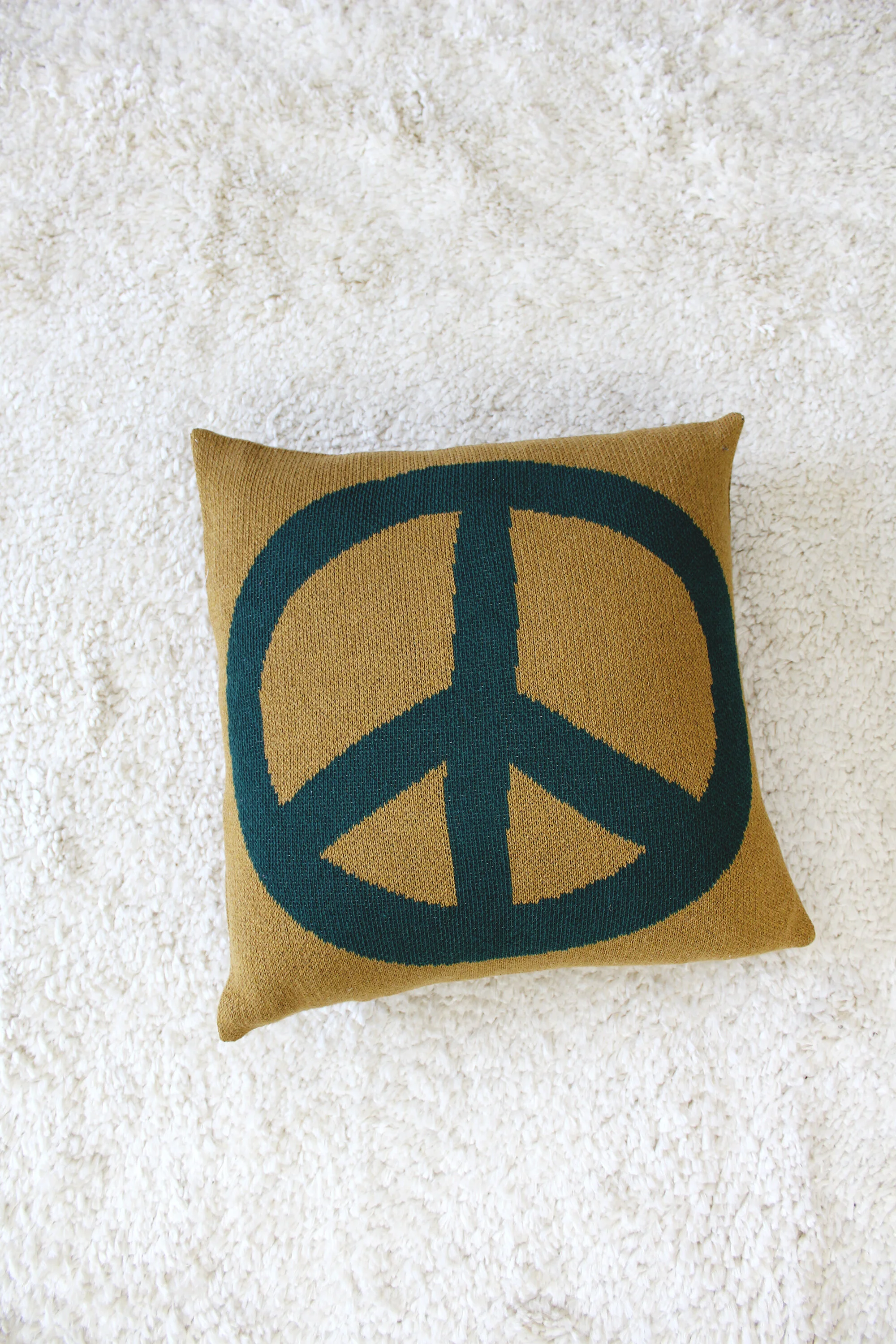 Peace Sign Pillow in Woodstock Green by Calhoun & Co.