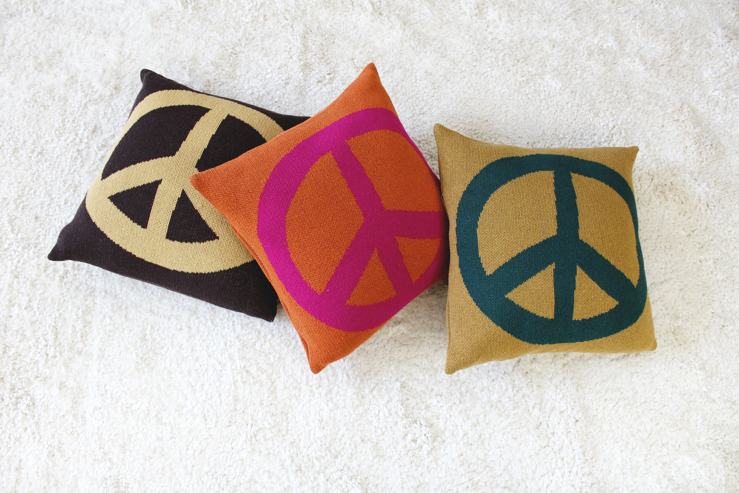 Peace Sign Pillow in Woodstock Green by Calhoun & Co.