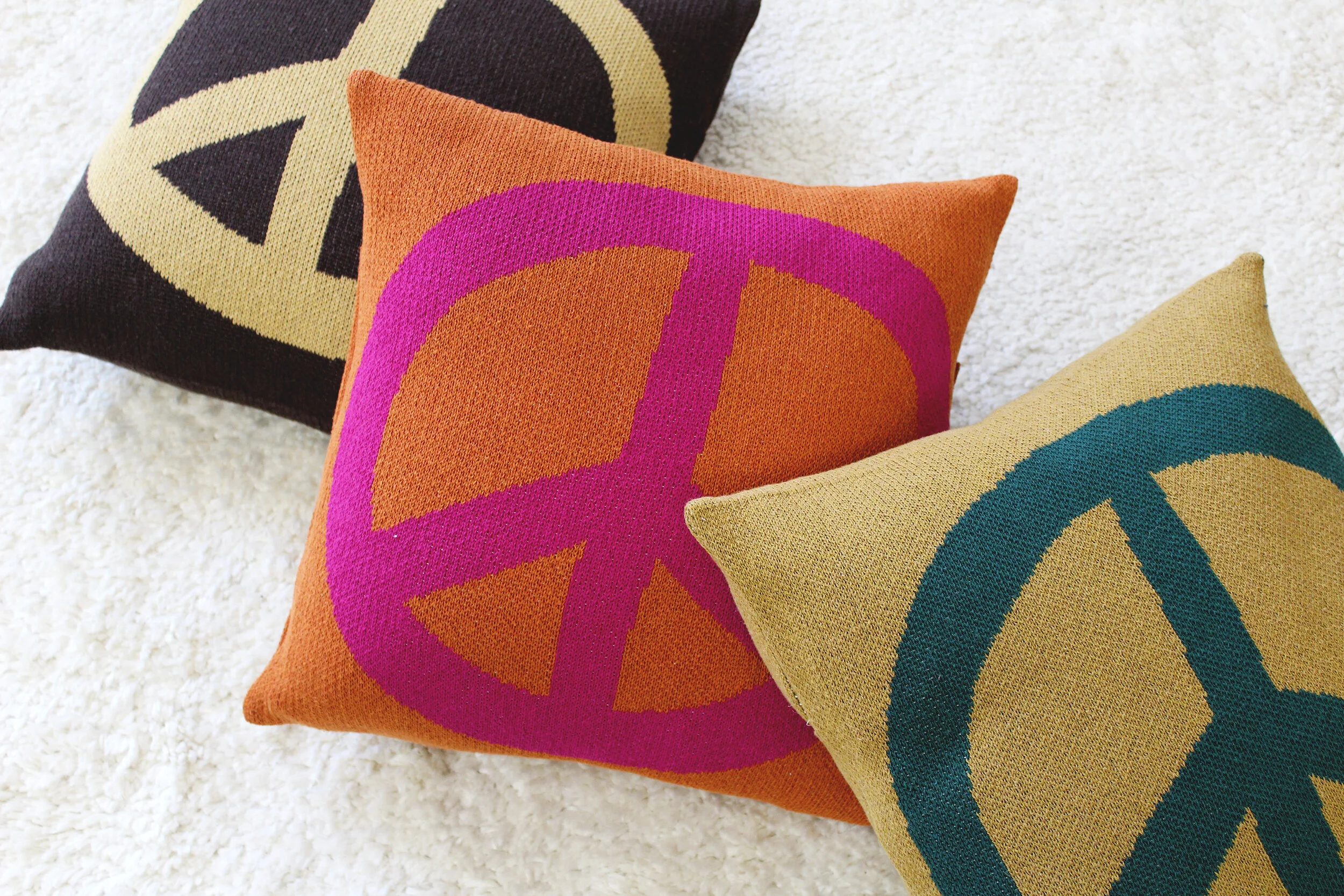 Peace Sign Pillow in Woodstock Green by Calhoun & Co.