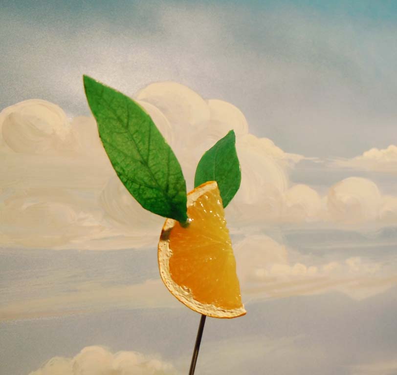 Flying Fake Lemon Wedge with Scenic Cloud Painting
