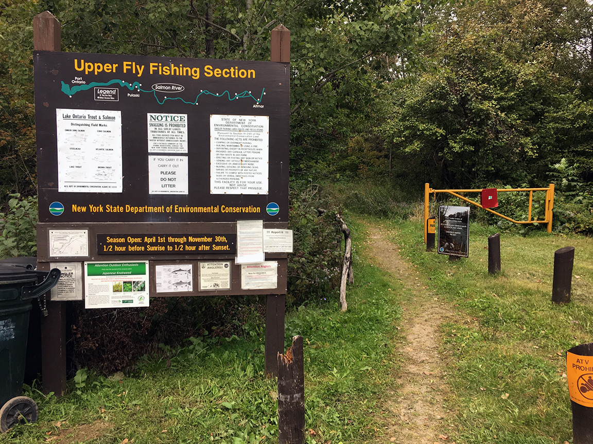 The state parking lot sign at the Upper Fly Zone.