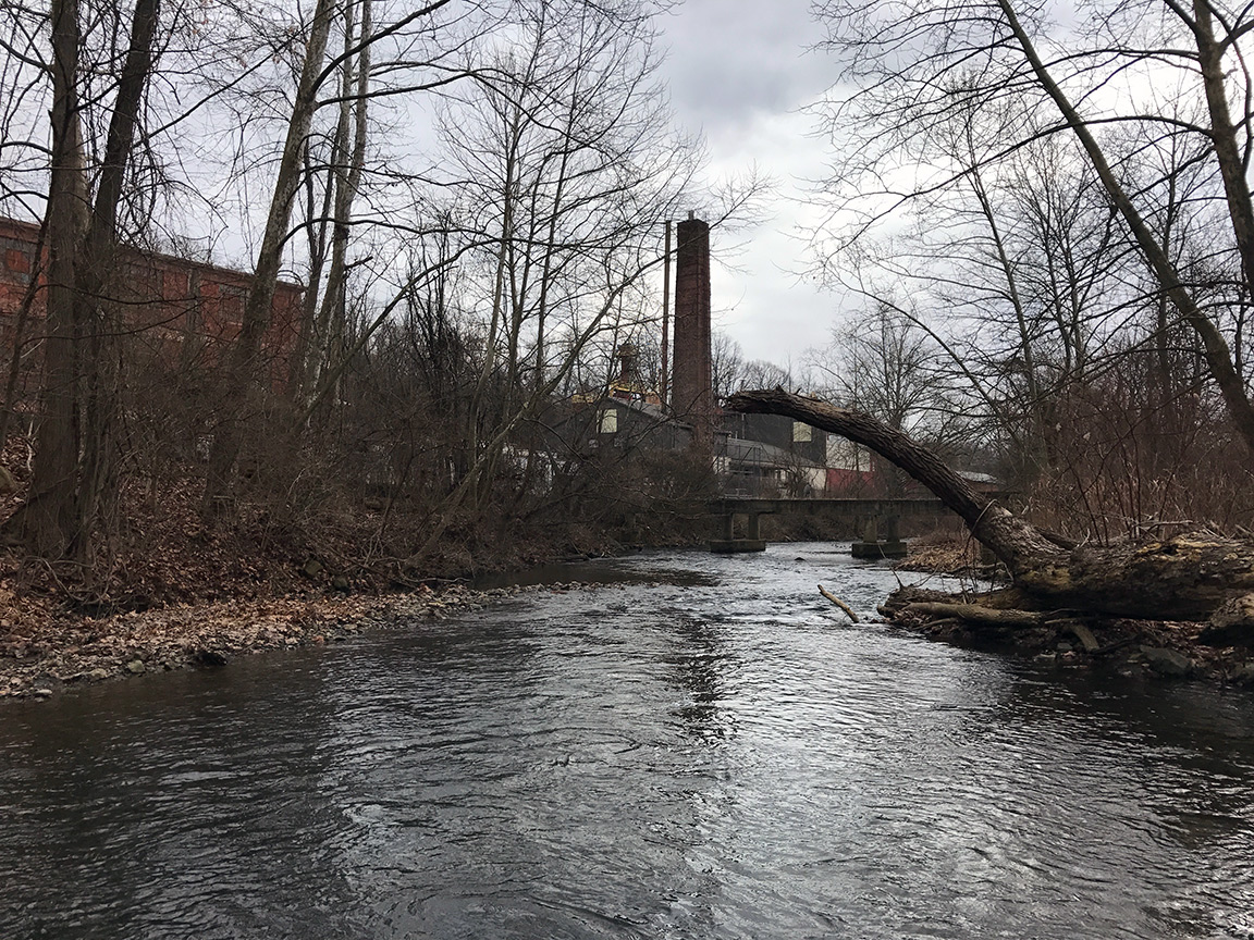 Foreboding smokestacks rise above the landscape on the Monocacy Creek.