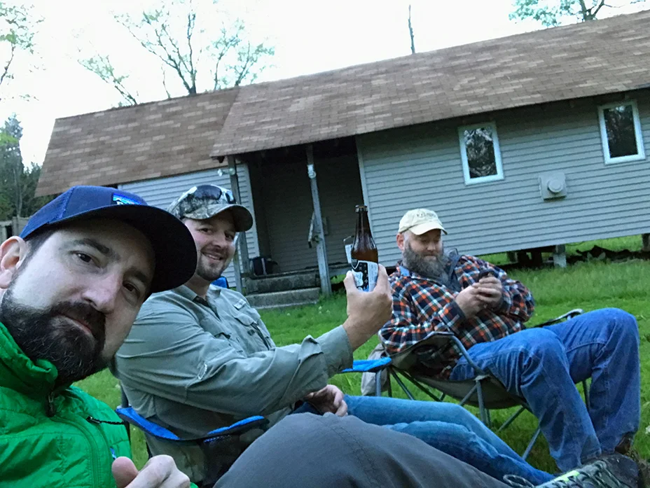 Relaxing by the fire swapping fish stories.