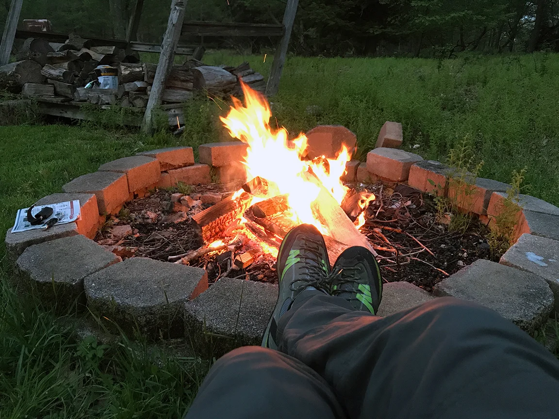 Watching the fire turn wood into burning embers.