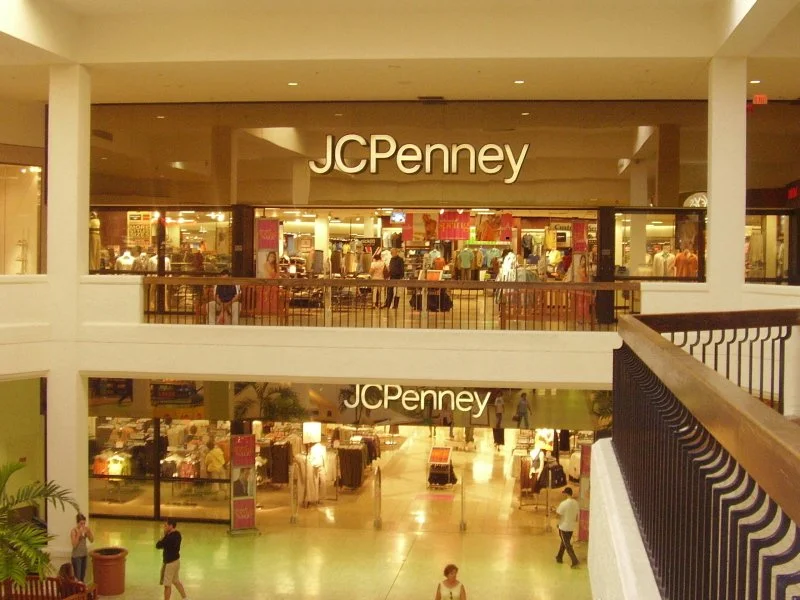 Interior view of a shopping mall with a two-story JCPenney store visible on both levels.