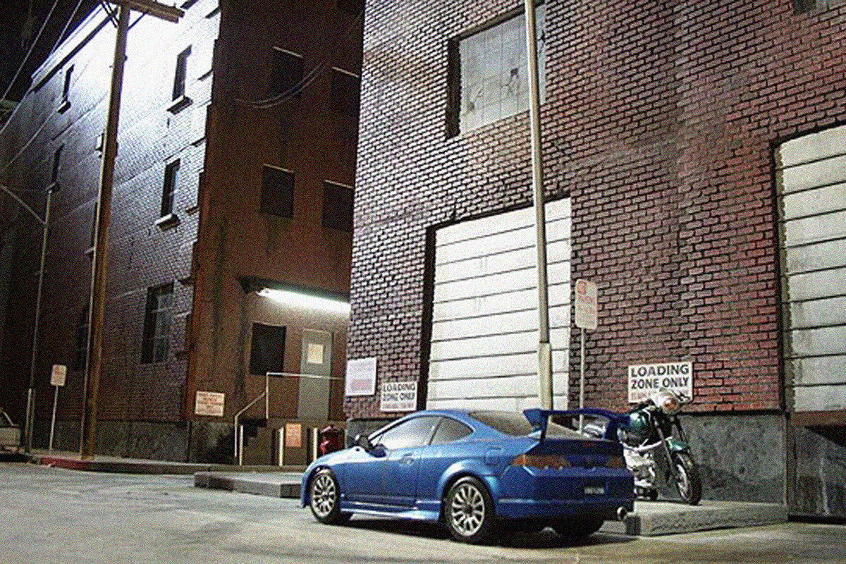 This IS NOT a real street - this is a 1/12th scale miniature built on a small stage in Los Angeles. This was much cheaper than trying to light up an entire street...