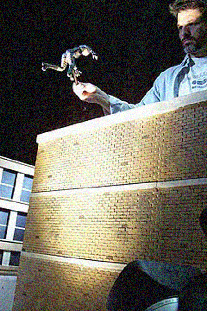 Preparing to film a demon puppet on a miniature set for "Guardian Of The Realm". She leapt from building to building, "Matrix"-style.