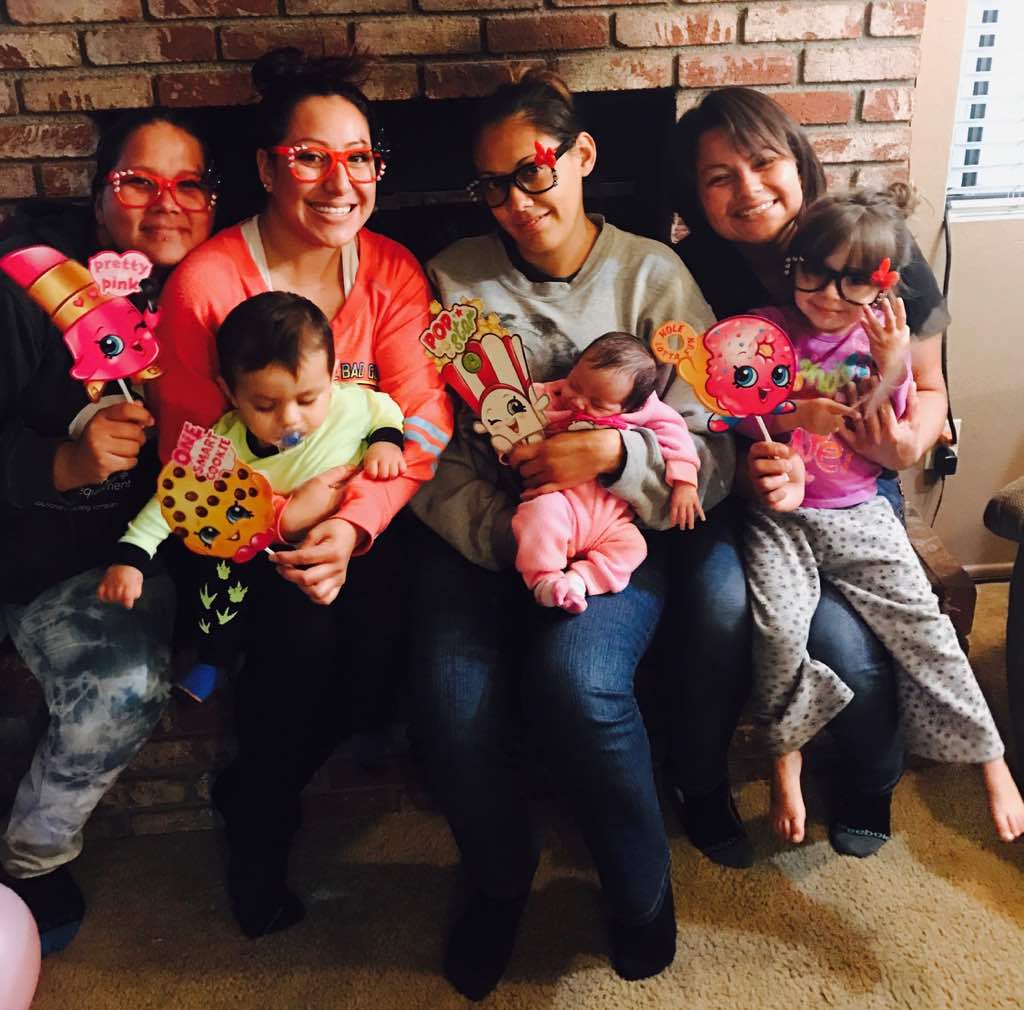 The moms and children showing off their new arts and crafts creations.