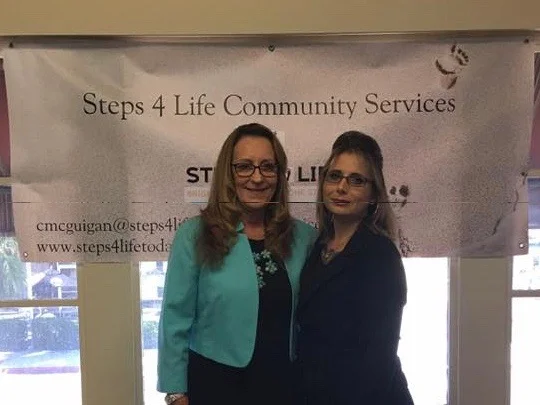 Cynthia and another supporter in our new office.