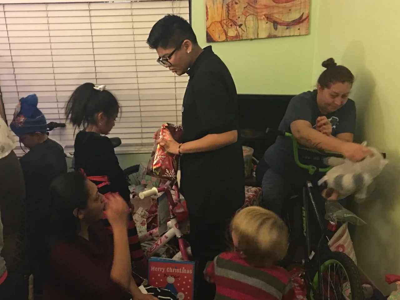 The children were very excited to begin opening their presents.