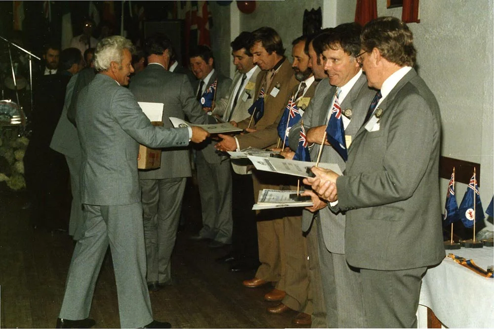 Charter members receive their membership certificates.