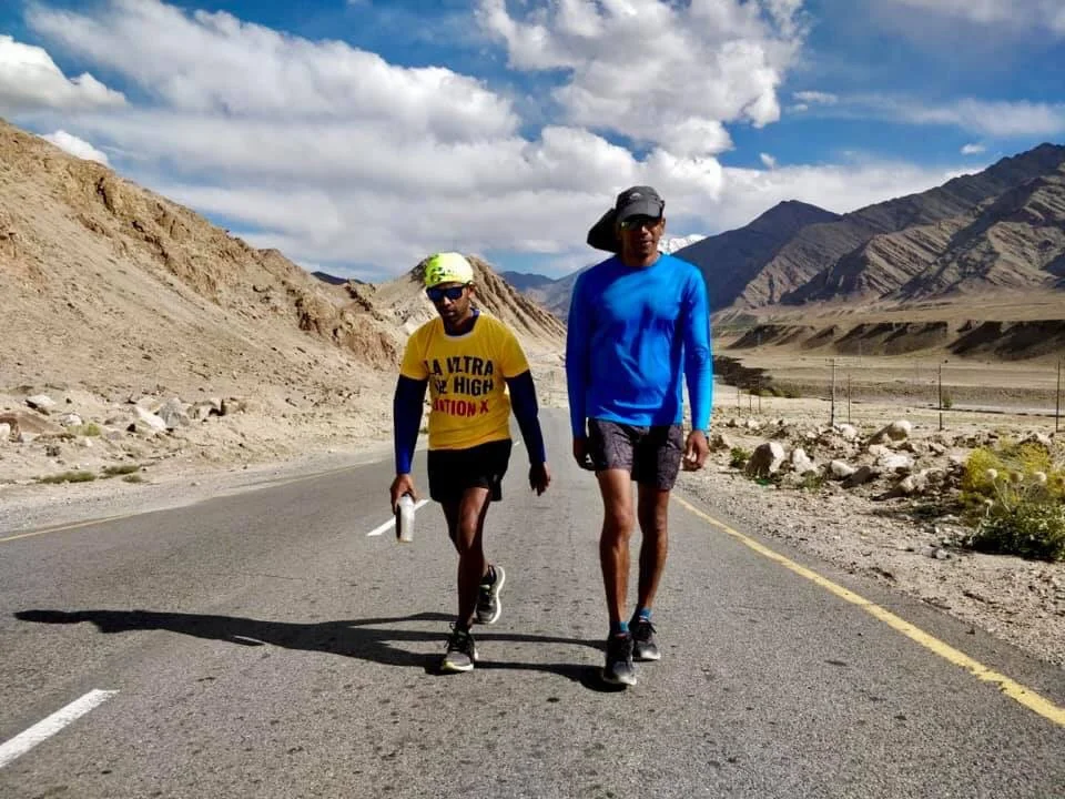 Ashish (blue) with his crew member, marches along.