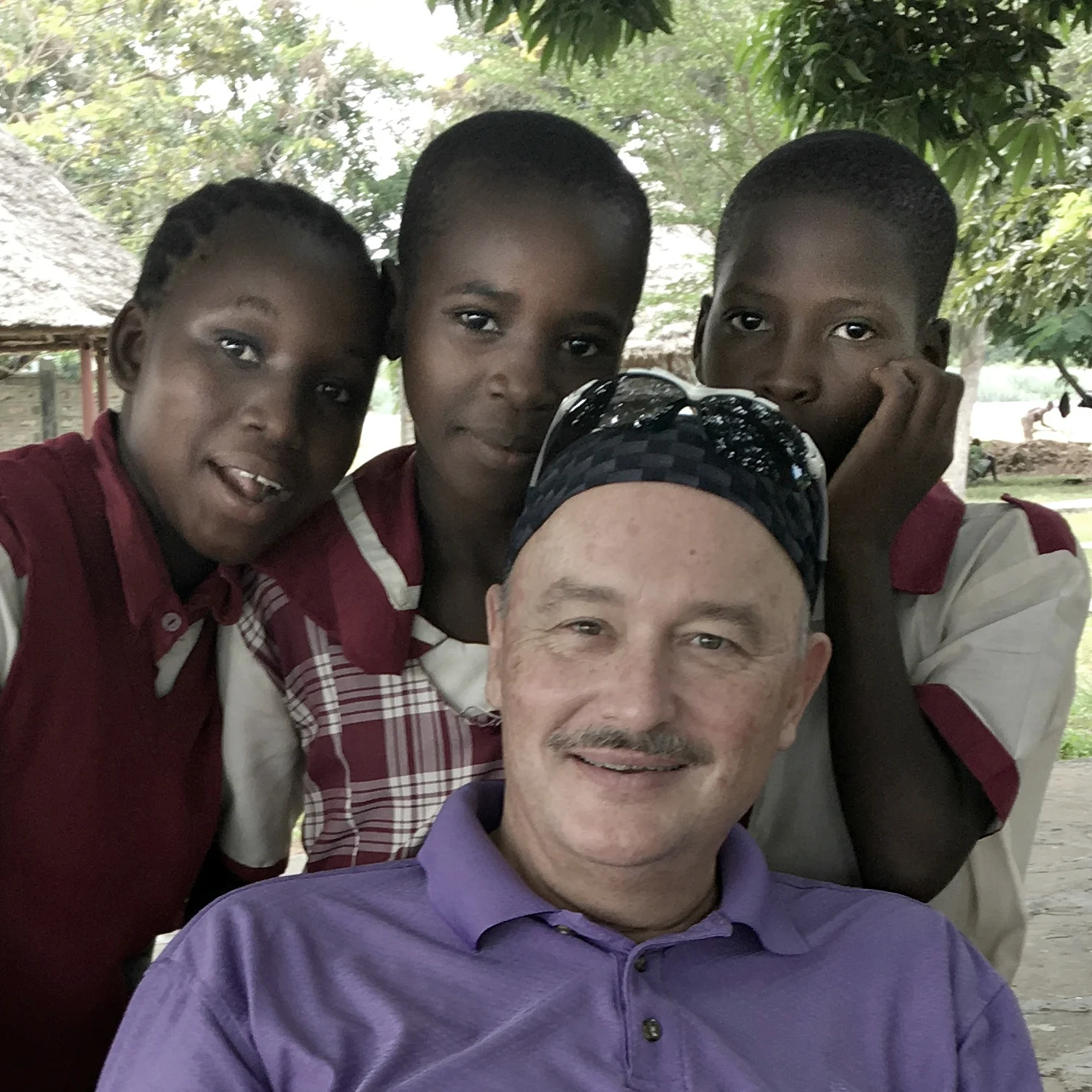 _00Gary with African girls.jpg