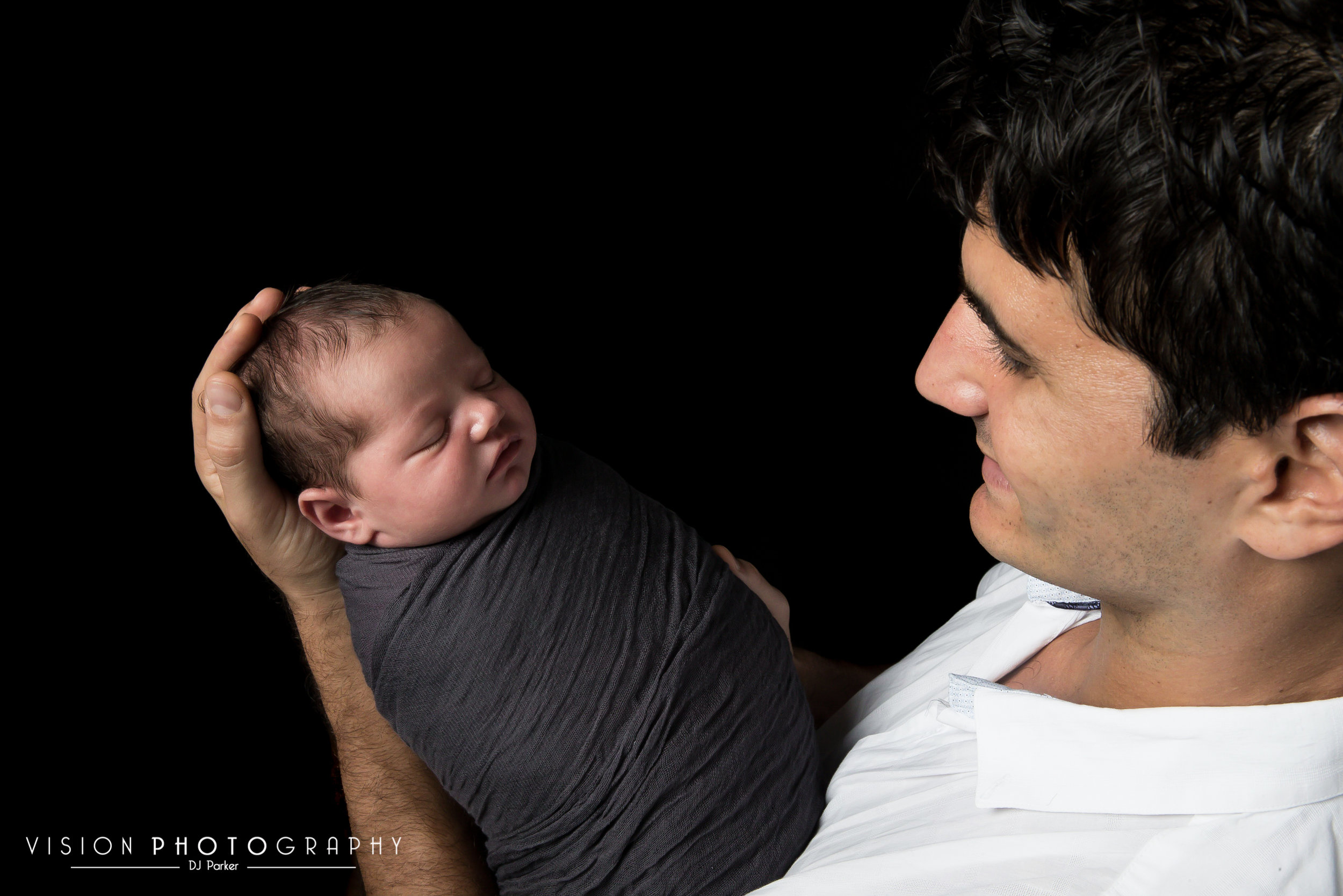 Newborn studio photography black background