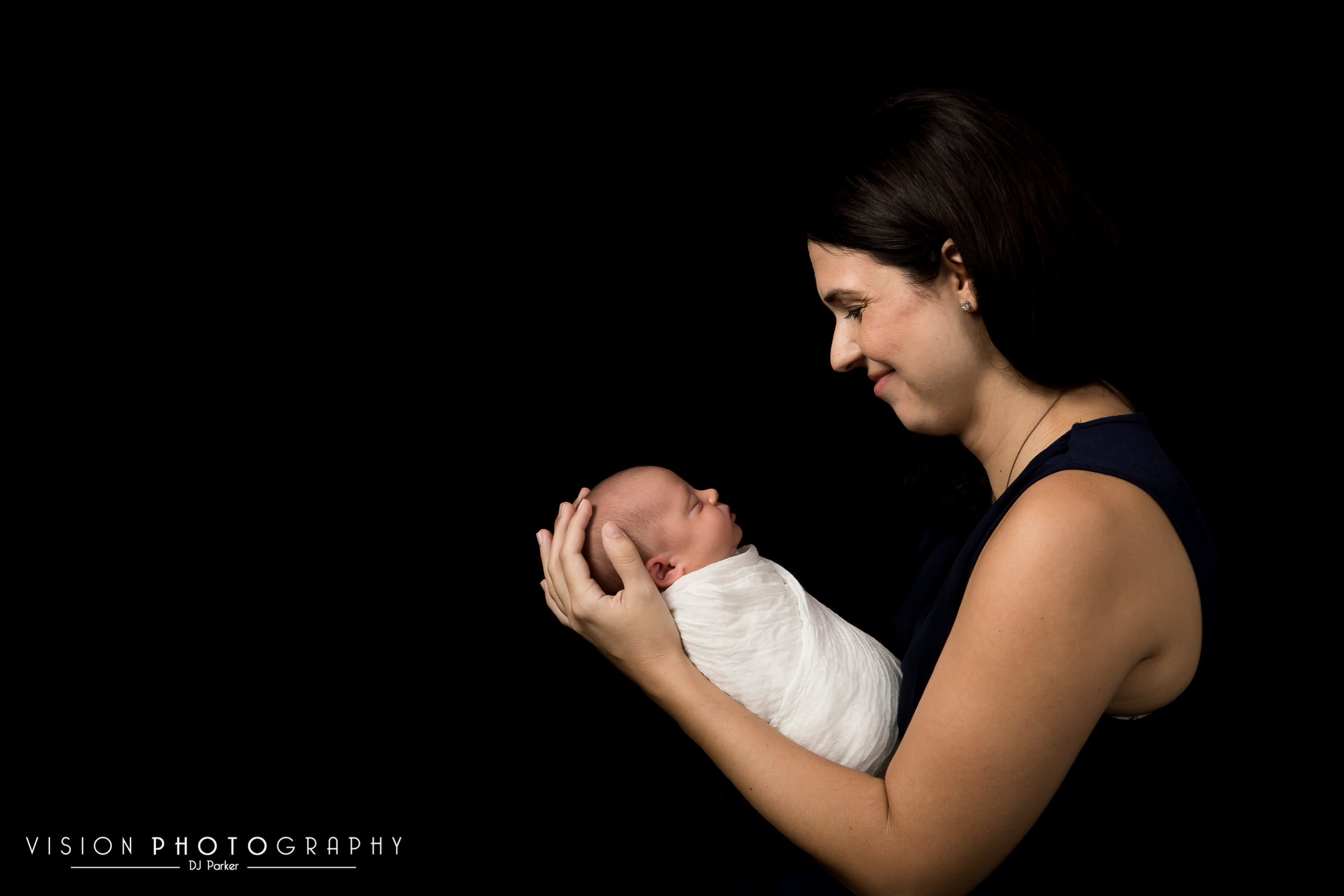 Newborn studio photography black background