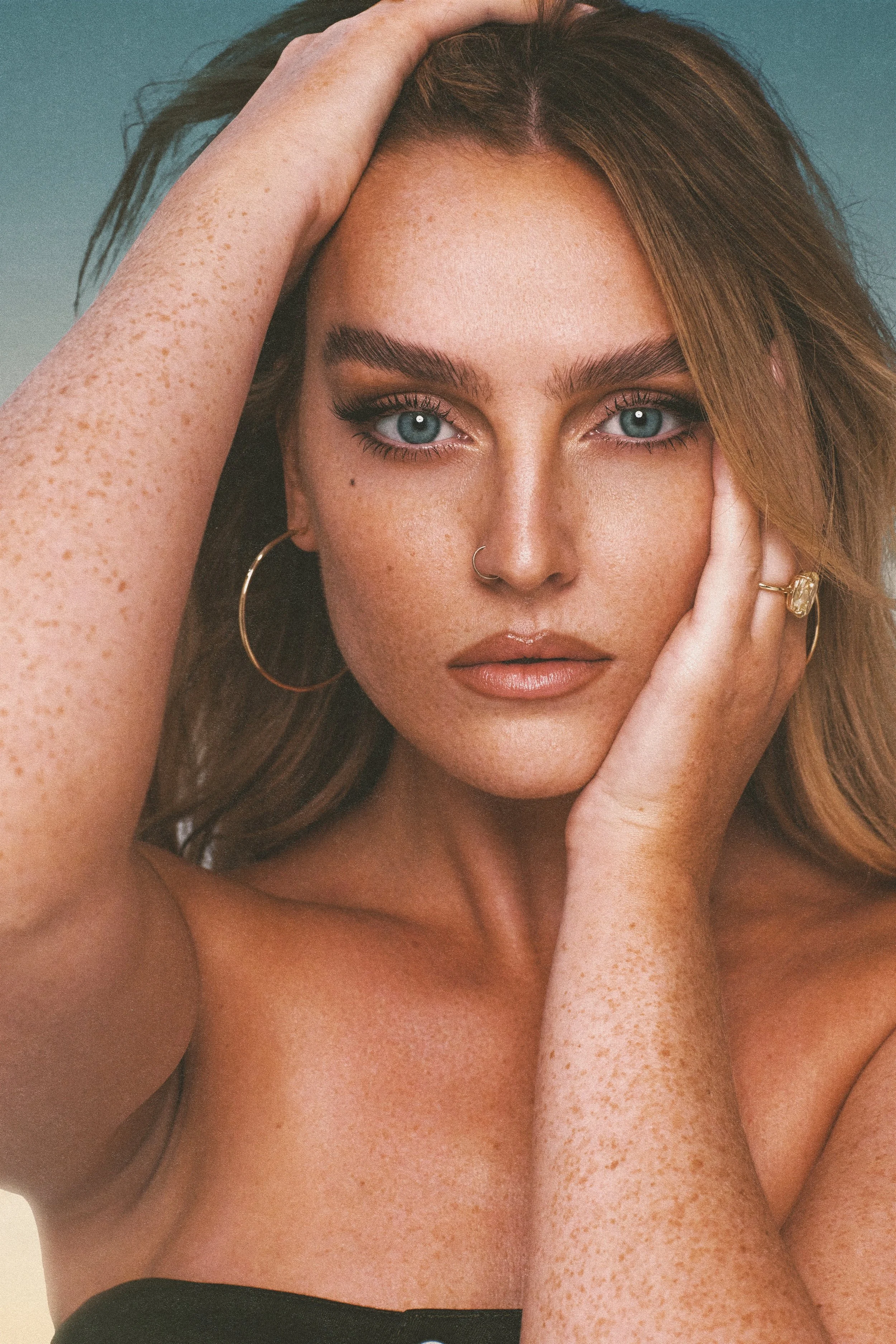 An aerial view of a field. A road runs through the upper right corner.