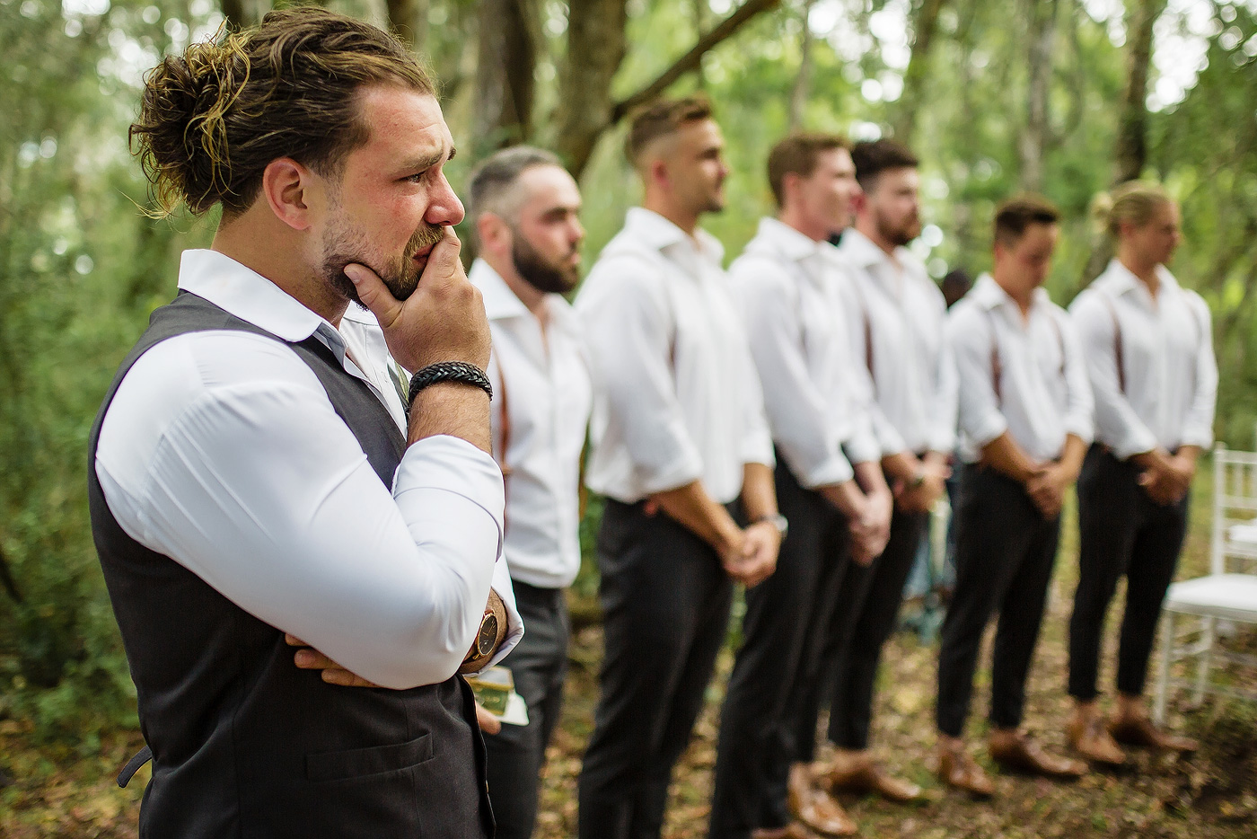 An emotional groom before the wedding ceremony in a forest