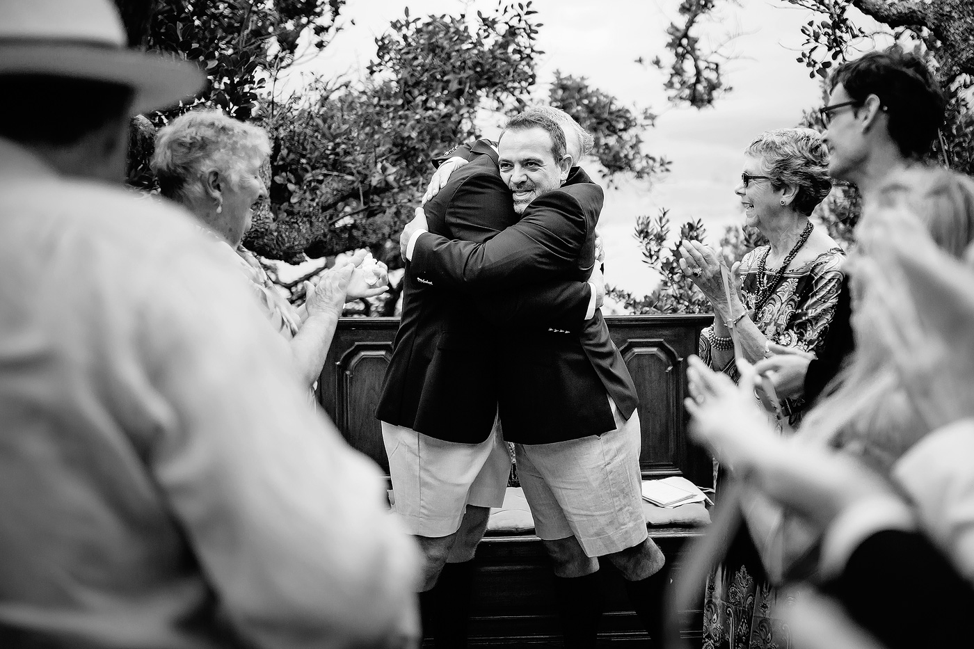 Two grooms embrace at their elopement in the Garden Route of South Africa.