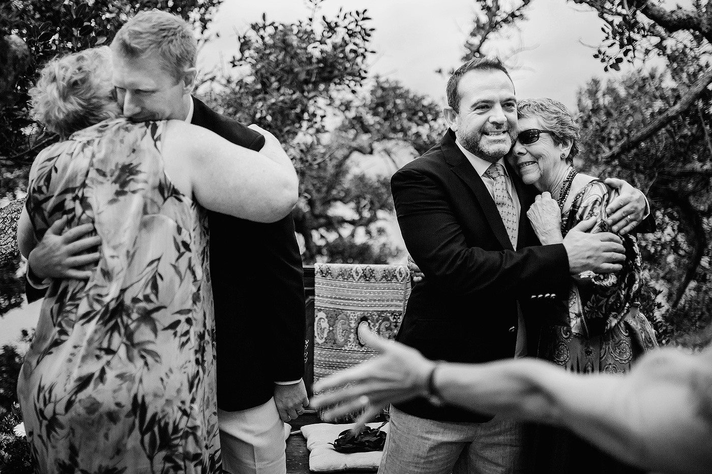 Moms embracing their sons at their elopement in the Garden Route.