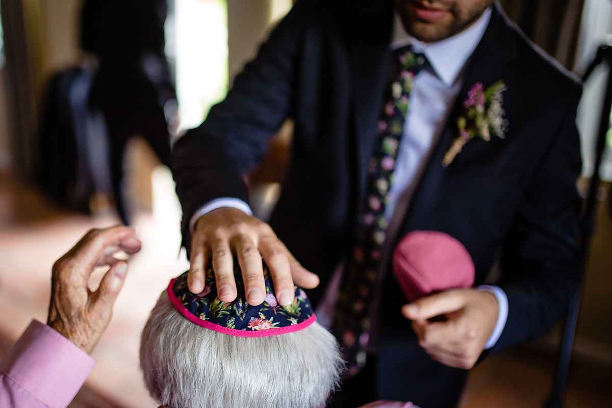 Jewish Groom putting on the Yarmuckle on his Grandfather