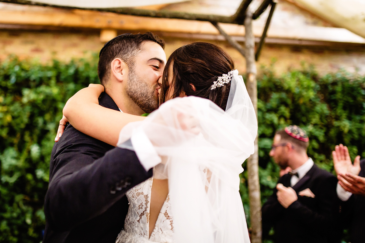 Bride and groom first kiss at Jewish Wedding in Plettenberg Bay