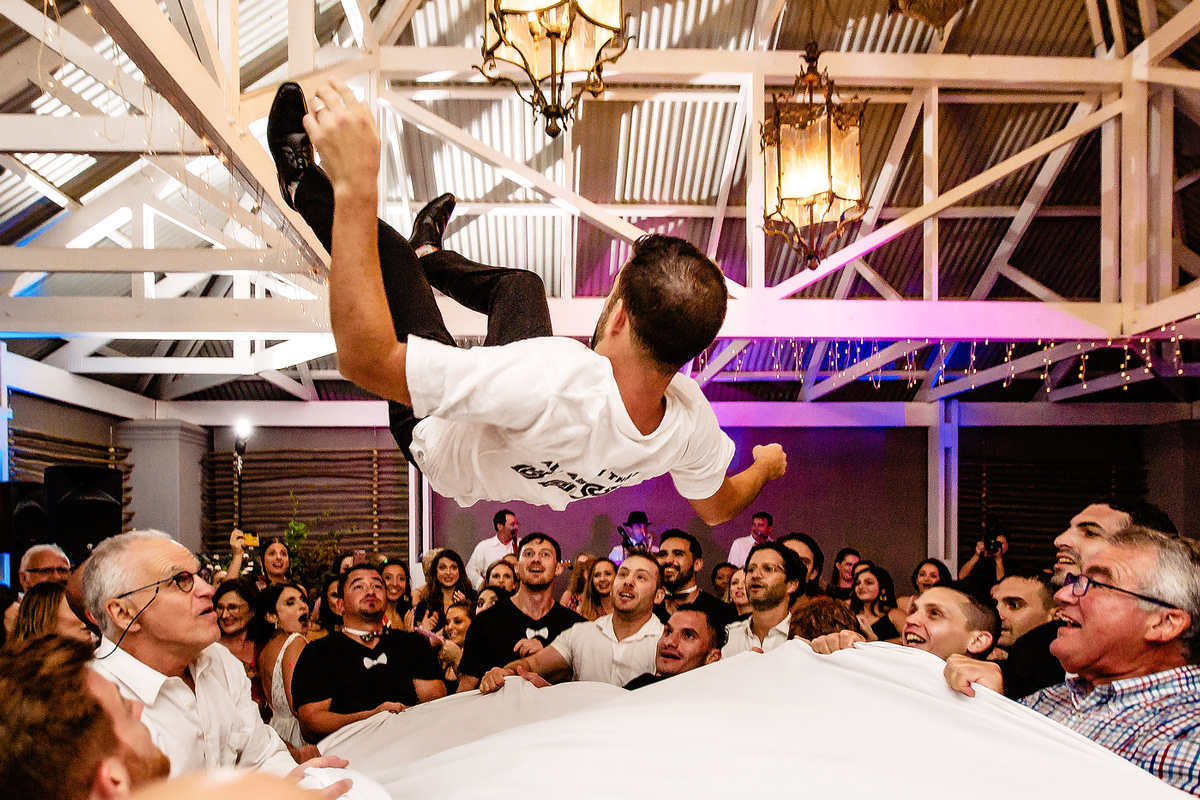 Groom thrown into the air during Jewish Wedding in Plett