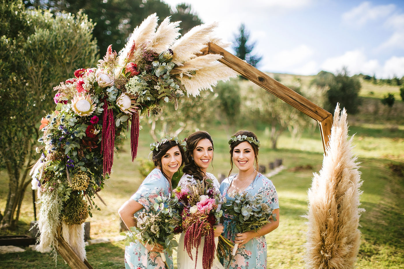 Bridesmaids with Floral Arch