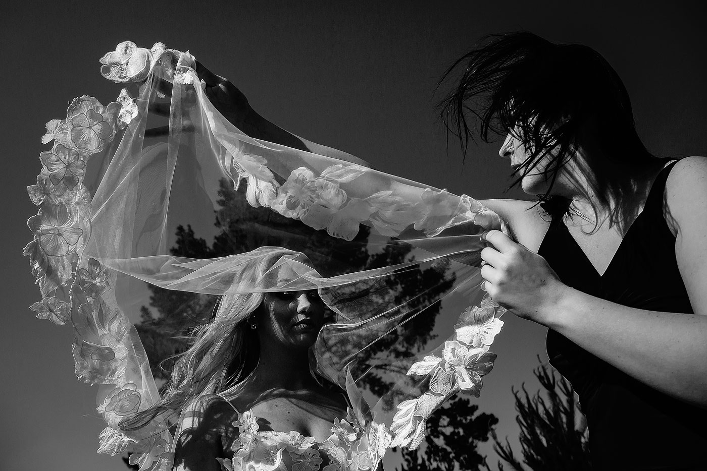Bride and Maid of Honour Wedding Ceremony Moment with Veil