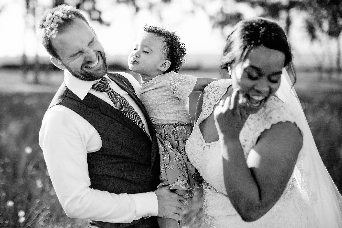 Wedding Family Moment between Bride Groom and Daughter