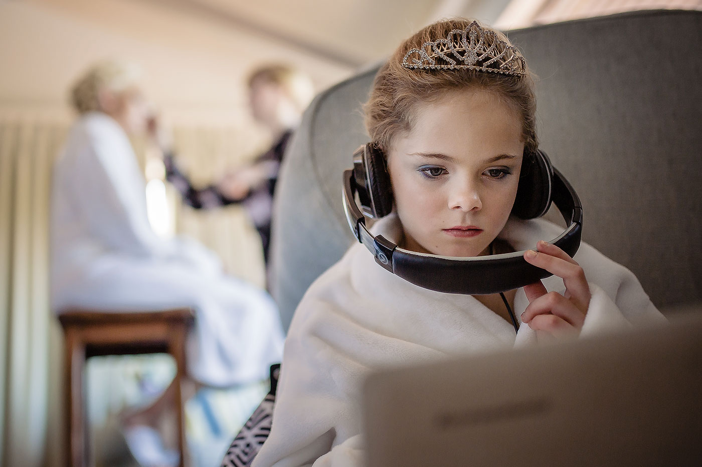 Flower Girl with crown playing games before the wedding