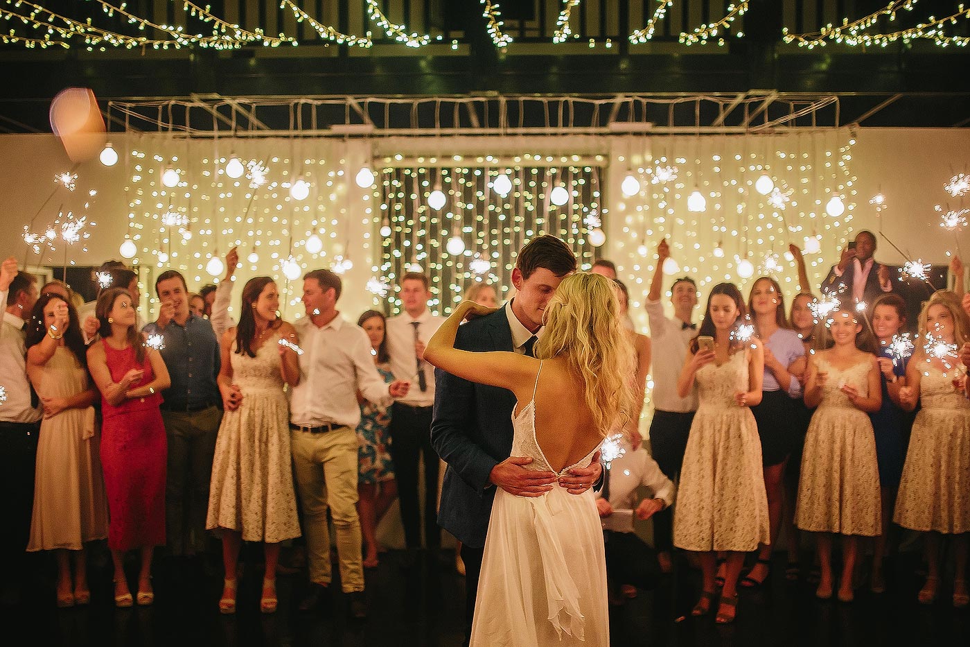 Elegant wedding first dance with fairy lights in Plettenberg Bay South Africa.