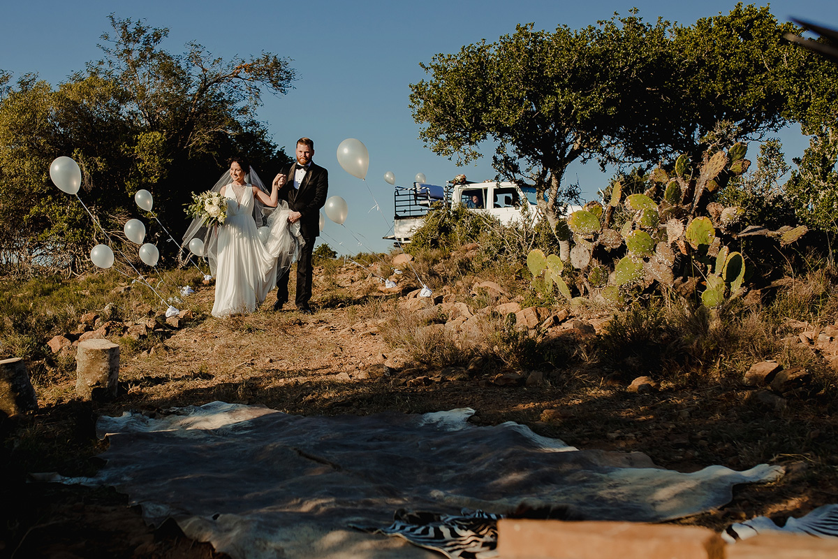 Bride and Groom walk into wedding ceremony area on a farm wedding.