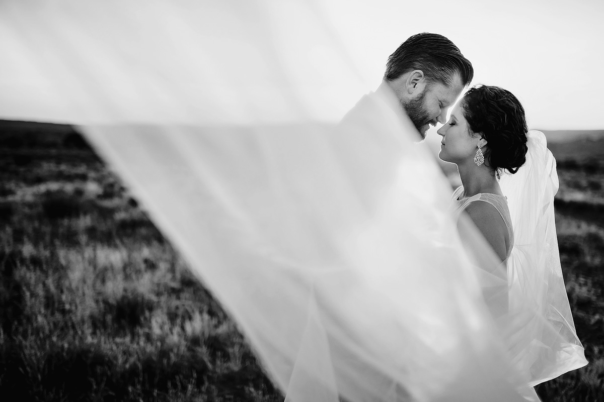 Intimate moment with veil between bride and groom at wedding in Eastern Cape